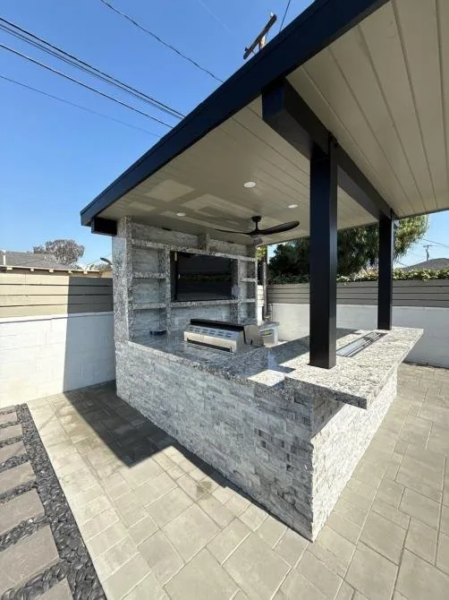 Outdoor living space and patio renovation by Ten Eight Renovations