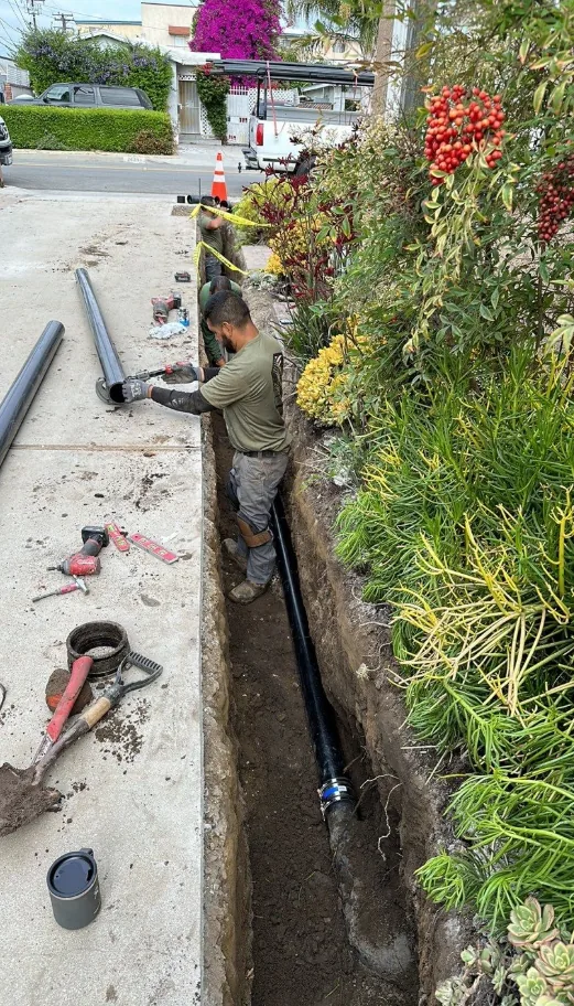 Sewer line trenching and pipe installation by Ten Eight Renovations